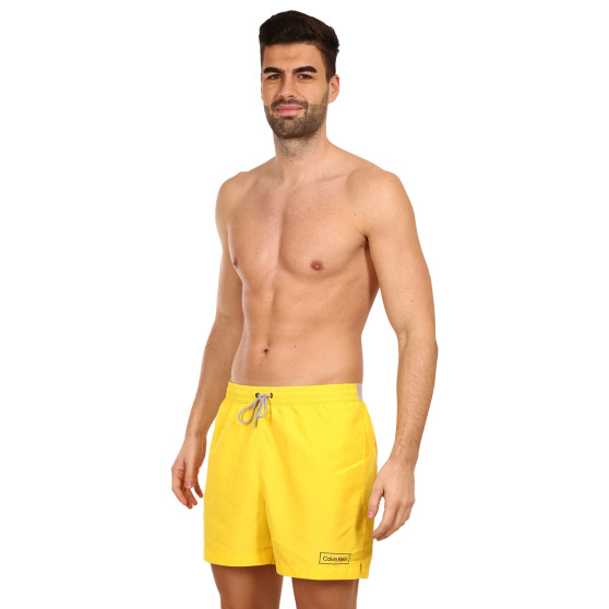 Vīriešu peldkostīmi Calvin Klein yellow (KM0KM00787 ZGR)