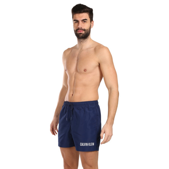 Vīriešu peldkostīmi Calvin Klein zils (KM0KM00992-C7E)