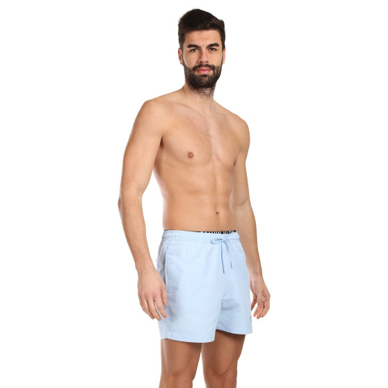 Vīriešu peldkostīmi Calvin Klein zils (KM0KM00992-C7S)