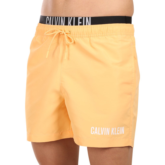 Vīriešu peldkostīmi Calvin Klein orange (KM0KM00992-SAN)