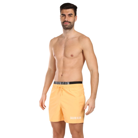 Vīriešu peldkostīmi Calvin Klein orange (KM0KM00992-SAN)