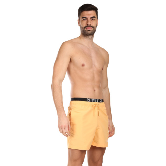 Vīriešu peldkostīmi Calvin Klein orange (KM0KM00992-SAN)