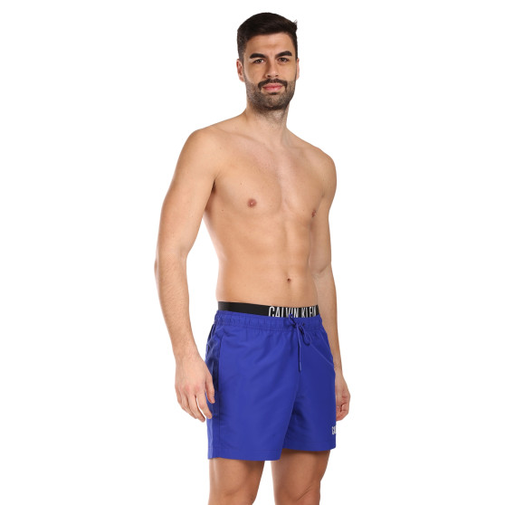 Vīriešu peldkostīmi Calvin Klein zils (KM0KM00992-C7N)