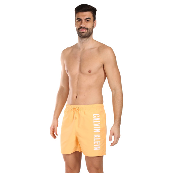 Vīriešu peldkostīmi Calvin Klein orange (KM0KM01004-SAN)